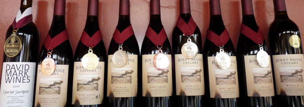 Bottles of Burnt Bridge wine, each wearing a medal.