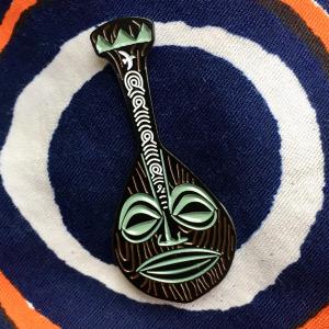 The 2019 enamel pin is shaped like the voyaging paddle decanter by VanTiki