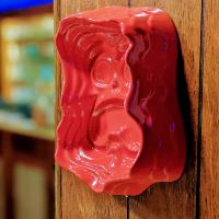 The Caldera mug/bowl shown hanging on a wall.